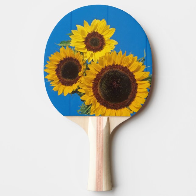 Sunflowers against blue fence ping pong paddle (Front)
