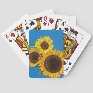 Sunflowers against blue fence playing cards