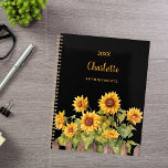 Sunflowers black 2025 planner<br><div class="desc">Embrace your organisational skills with our Personalised Sunflower Garden Spiral Planner. Perfect for staying on top of your schedule with a touch of rustic charm, this planner combines functionality with a beautiful and personalised design. Elegant Black Background: The sophisticated black backdrop provides a striking contrast, making the vibrant watercolor sunflowers...</div>