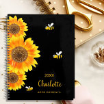 Sunflowers monogram cute bees black planner<br><div class="desc">A chic black background colour.  Decorated with large watercolored sunflowers and 3 cute,  happy smiling bees.  Personalise and add a name,  year and a title. The name is written in black with a large modern hand lettered style script. Perfect for school,  work or organising your personal/family life</div>