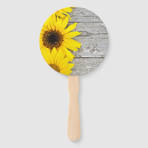 Sunflowers on a table hand fan