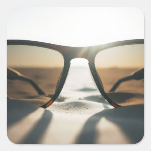 Sunglasses on Sand Square Sticker