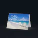 Sunny Beach With 2 Chairs Christmas Card<br><div class="desc">Warm Christmas wishes from the beach! A beautiful sunny beach with ocean waves crashing along the sand. There's 2 high back white beach chairs facing the ocean. Across the front it reads,  "Hello Christmas". Check out the many design & styles in our store.</div>