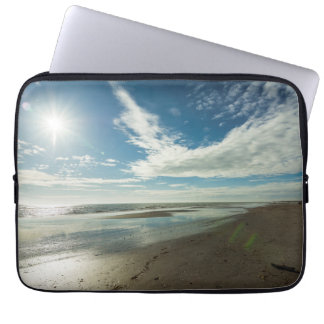 Sunny day on a winter sandy beach laptop sleeve