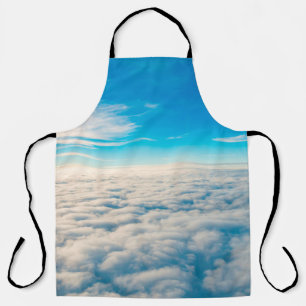 Sunrise above clouds from aeroplane window apron