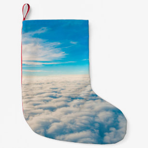 Sunrise above clouds from aeroplane window small christmas stocking