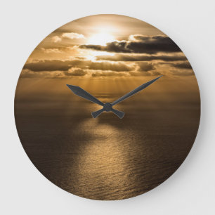Sunrise above the Atlantic ocean Large Clock