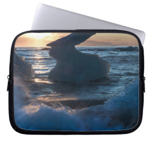 Sunrise and iceberg formation on the beach laptop sleeve