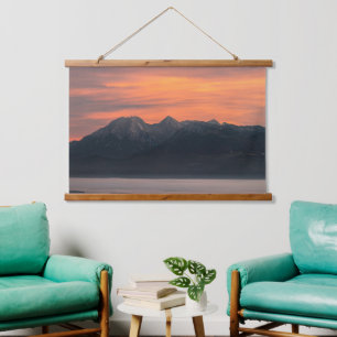 Sunrise behind majestic mountains hanging tapestry