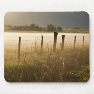 Sunrise lights fog along fence near Charlo Mouse Pad