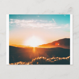 sunrise over a mountain postcard