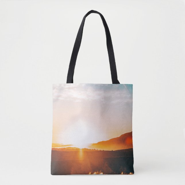 sunrise over a mountain tote bag (Front)
