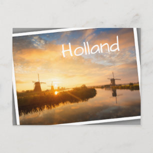 Sunrise over windmills and a river in Holland Postcard