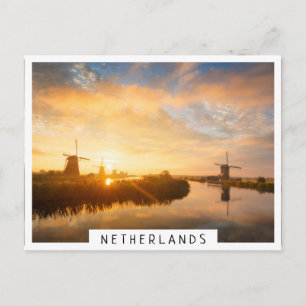 Sunrise over windmills and a river in Holland Postcard