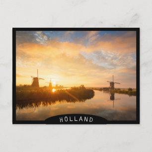 Sunrise over windmills and a river in Holland Postcard