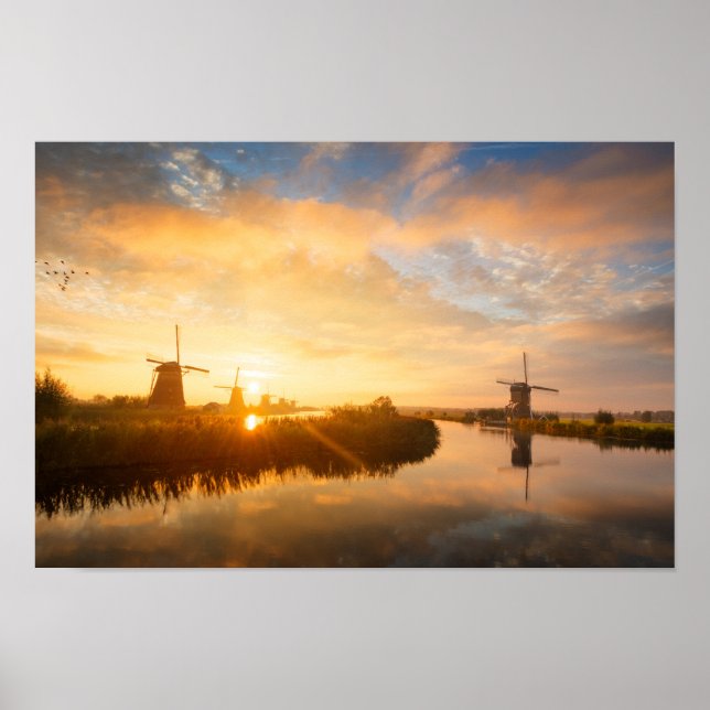 Sunrise over windmills and a river in Holland Poster (Front)