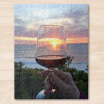 Sunset<br><div class="desc">Say Cheers to the sunset and your friends!
This jigsaw puzzle features a sunset on the French coast seen through a glass of red wine. Santé</div>