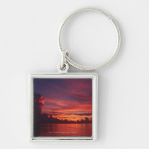Sunset at sea with dark clouds key ring