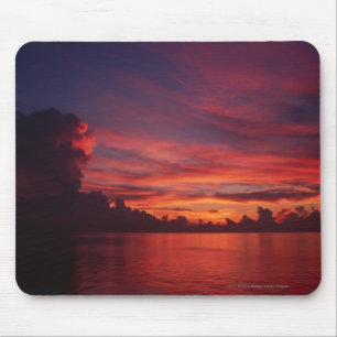 Sunset at sea with dark clouds mouse pad