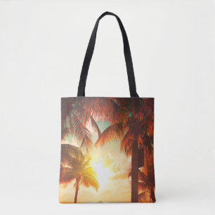Sunset beach with palm trees and beautiful sky lan tote bag