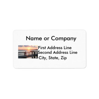 Sunset behind dock in Florida with little girl Label