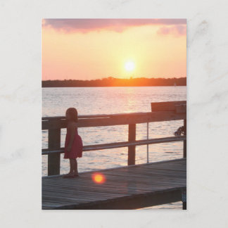 Sunset behind dock in Florida with little girl Postcard
