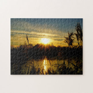 Sunset by a pond with reed plumes. jigsaw puzzle