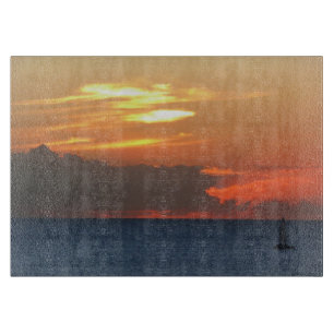 Sunset Clouds and Sailboat Seascape Cutting Board