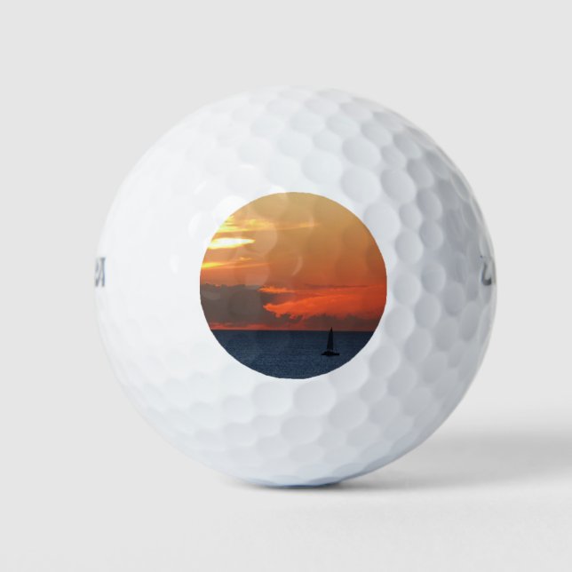 Sunset Clouds and Sailboat Seascape Golf Balls (Front)