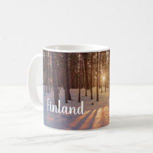 Sunset in snowy winter pine forest coffee mug
