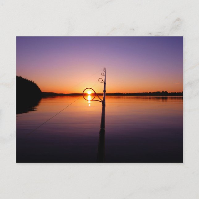 Sunset on a summer lake seen through a fishing rod postcard (Front)