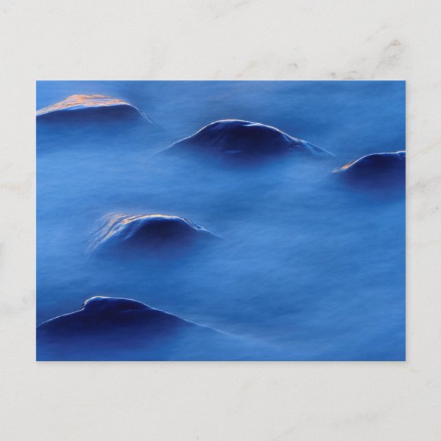 Sunset on rocks protruding through foamy water postcard (Front)