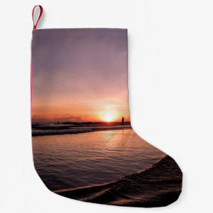 Sunset on the beach is dark light and be strong su small christmas stocking