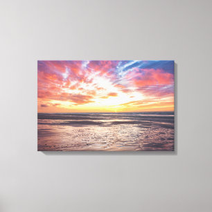 Sunset over beach and sea canvas print