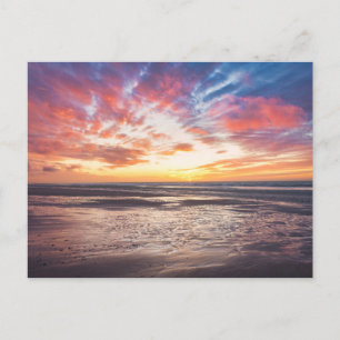 Sunset over beach and sea postcard