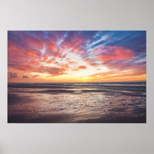 Sunset over beach and sea poster