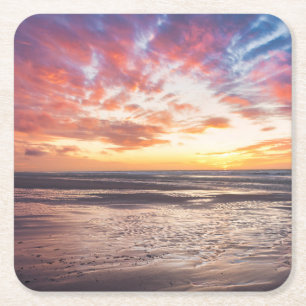 Sunset over beach and sea square paper coaster