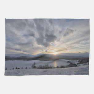 Sunset over frozen lake tea towel