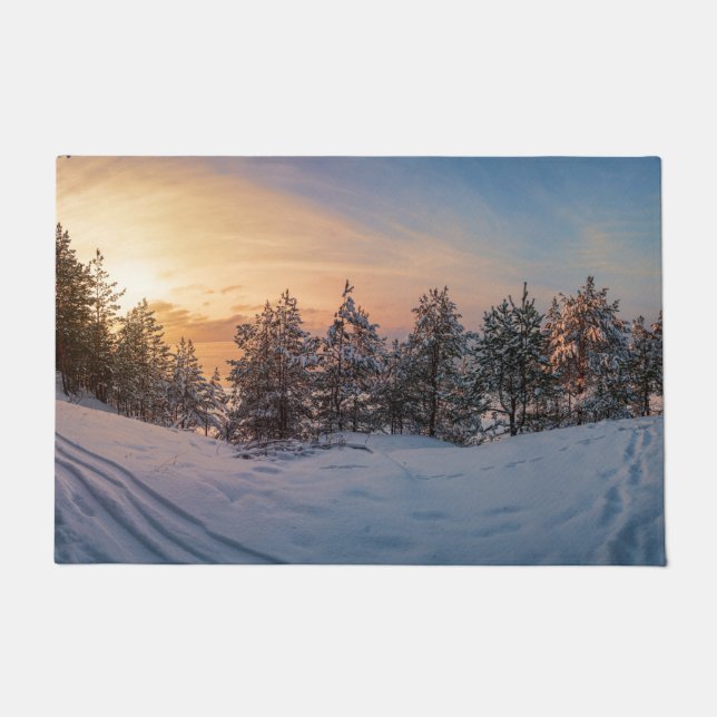 Sunset over frozen snowy forest near sea doormat (Front)