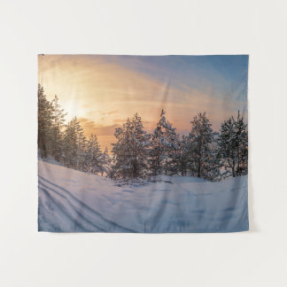 Sunset over frozen snowy forest near sea tapestry
