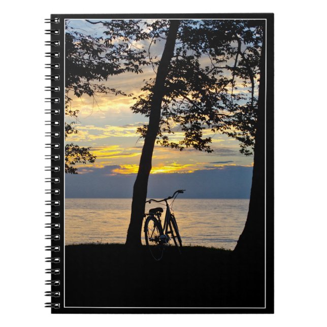 Sunset over lake with bicycle notebook (Front)