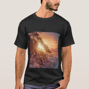 Sunset over sea and snowy pine tree T-Shirt