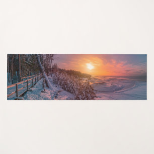 Sunset over snow sea coast yoga mat
