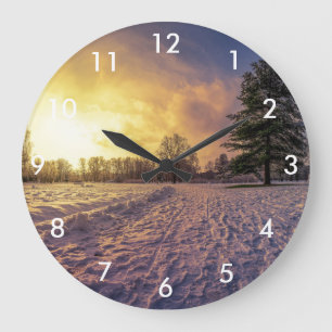 Sunset over snowy winter park large clock