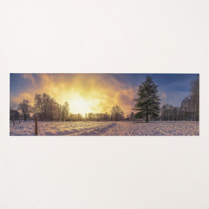 Sunset over snowy winter park yoga mat