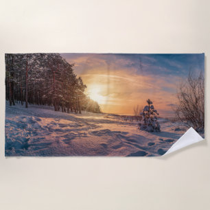 Sunset over snowy winter sea coast beach towel