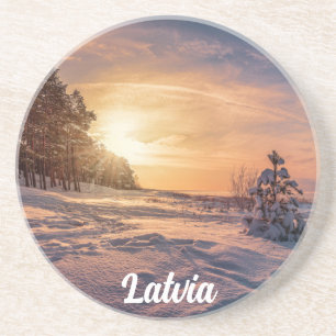 Sunset over snowy winter sea coast coaster