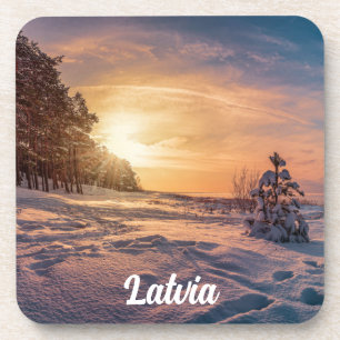 Sunset over snowy winter sea coast coaster