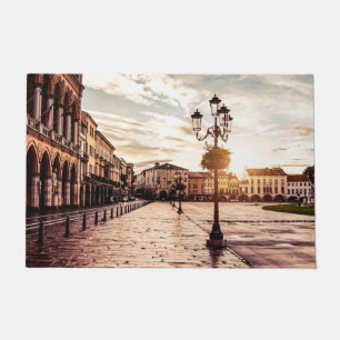Sunset over square in Padova in Italy Doormat