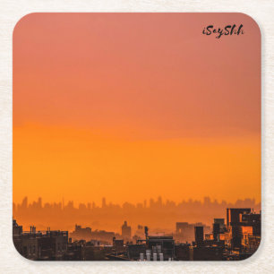 Sunset over the city square paper coaster